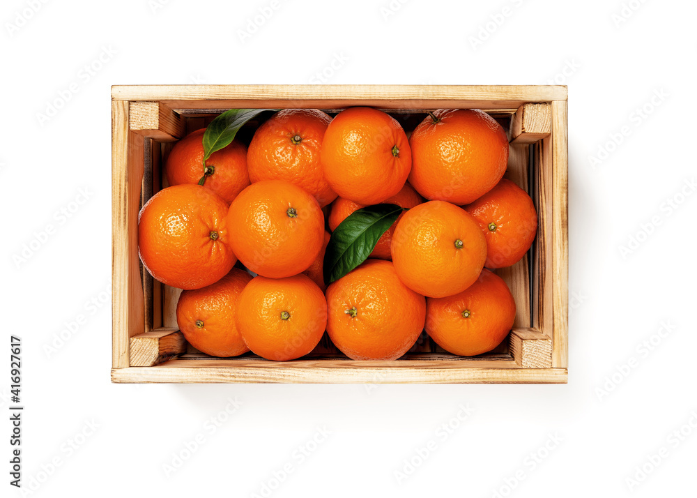 Sweet ripe orange tangerines in a wooden crate isolated on white background. Fresh citrus in a wood box. Eco-friendly rustic style containers for fruits and vegetables. Vegetarian and healthy eating.