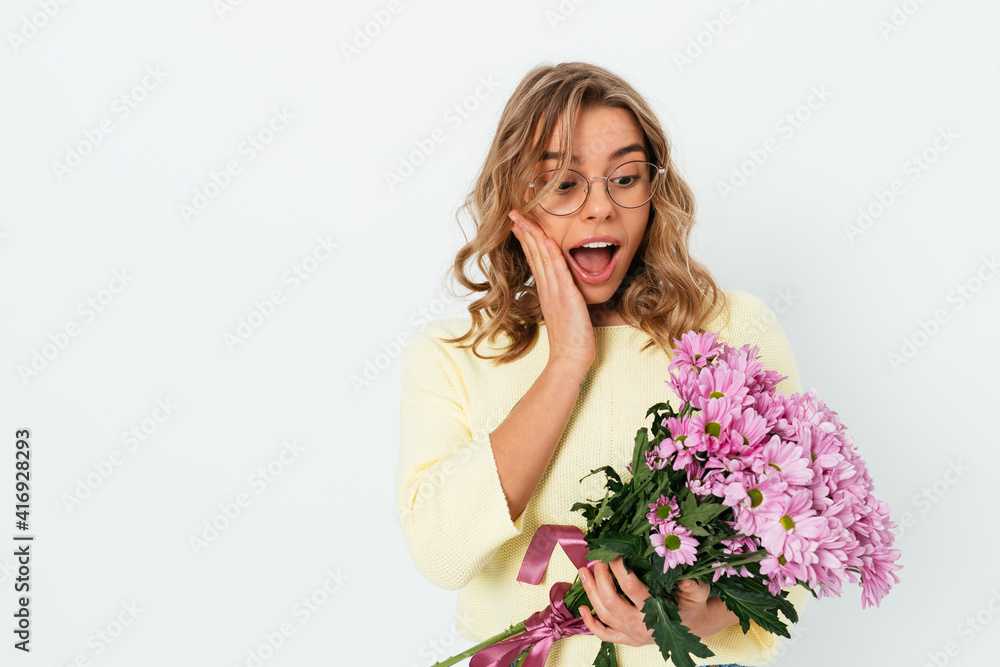 Amazed cute young woman wearing glasses and casual clothes Amazed cute young woman wearing glasses and casual clothes