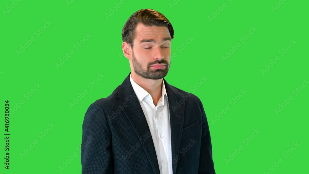 Business man waiting and using a smart watch to check message on a Green Screen, Chroma Key. Business man waiting and using a smart watch to check message on a Green Screen, Chroma Key.