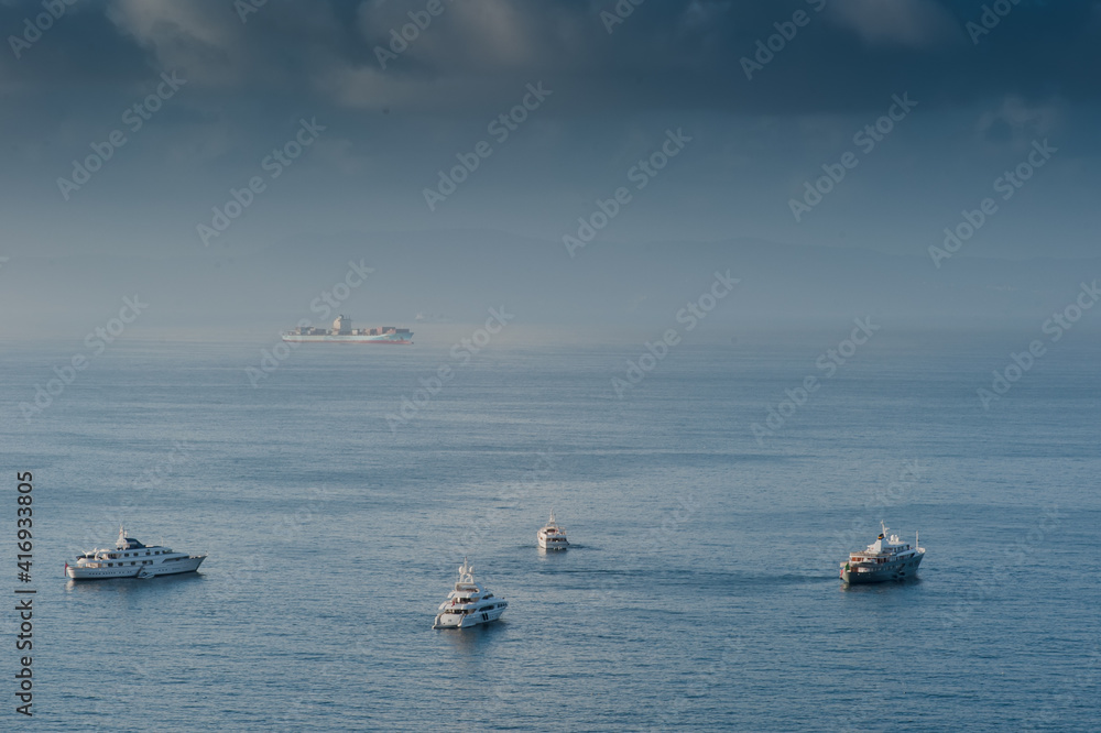 Boats the background of the sea and blue sky with beautiful clouds