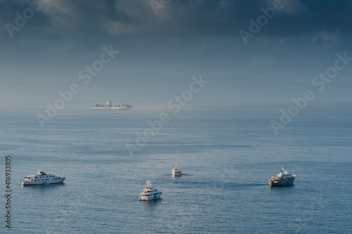 Boats the background of the sea and blue sky with beautiful clouds