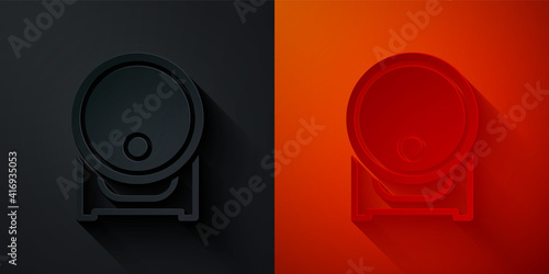 Paper cut Wooden barrel on rack with stopcock icon isolated on black and red background. Paper art style. Vector.