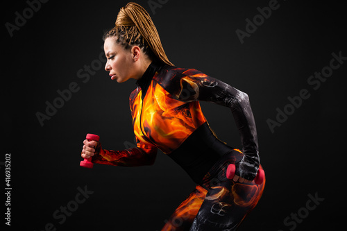 beautiful woman in a tracksuit is engaged in training   © Alexandr