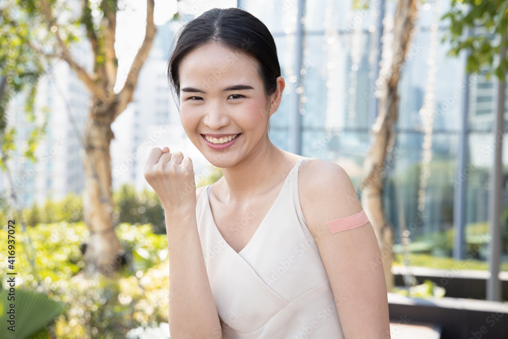 Healthy and strong asian woman getting inoculated or vaccinated immunity by vaccine program, concept of recommended inoculation, vaccination roll-out, vaccine volunteer or vaccinated community people Healthy and strong asian woman getting inoculated or vaccinated immunity by vaccine program, concept of recommended inoculation, vaccination roll-out, vaccine volunteer or vaccinated community people