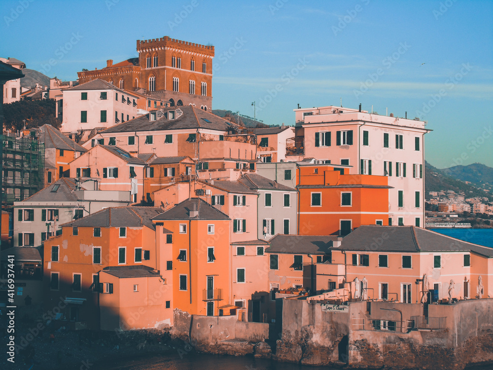 Genova, Italy - February 26, 2021: Editing some old photos of the city of Genova from home with basic struments. Detailed view to the old buildings near the seaside. Genova, Italy - February 26, 2021: Editing some old photos of the city of Genova from home with basic struments. Detailed view to the old buildings near the seaside.