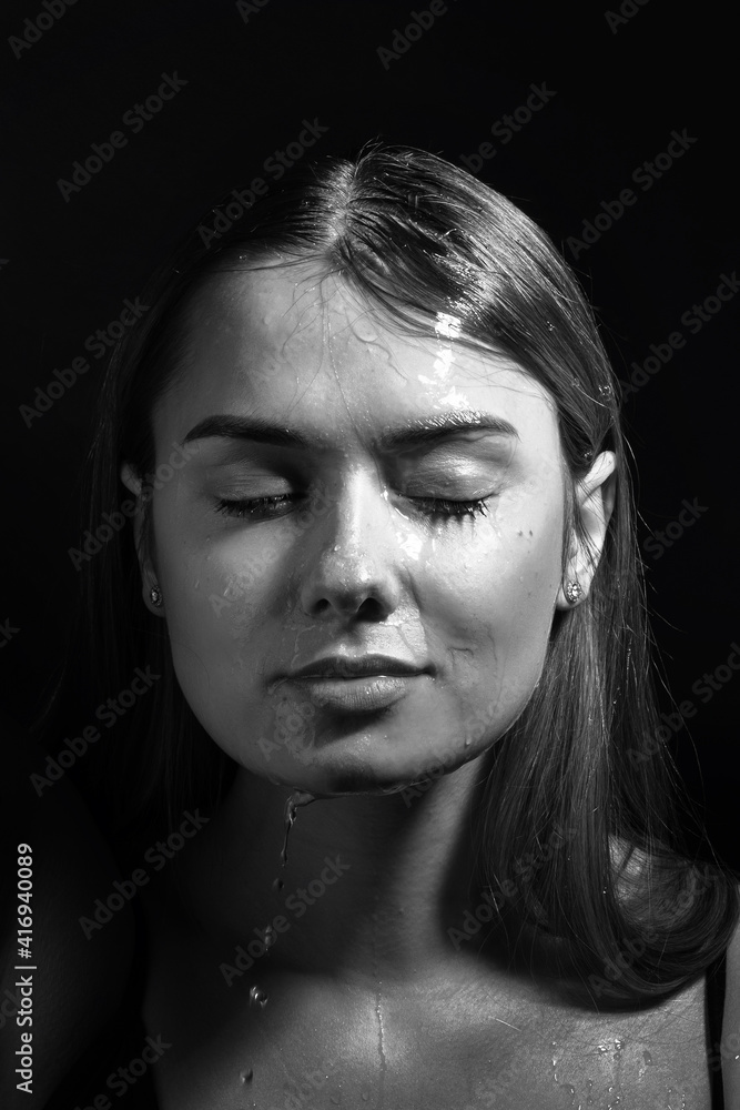 Water runs down my face. Portrait of a young beautiful woman Water runs down my face. Portrait of a young beautiful woman