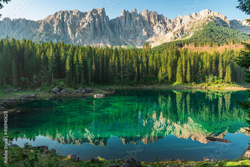Beautiful view on Lago di Carezza lake or Karersee with mountains reflection in italian dolomites alps, Italy