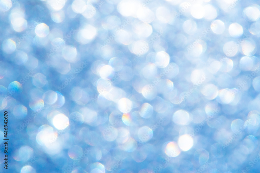 bright glitter background: bokeh effect from many colored lights on frozen glass, toning bright glitter background: bokeh effect from many colored lights on frozen glass, toning