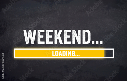 Black chalkboard with yellow loading bar and message weekend loading photo