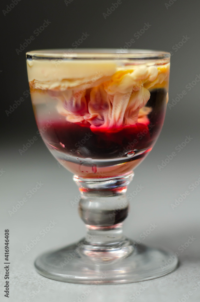Interesting drink shot based on cream, liqueur and grenadine called Brain Hemorrhage prepared for Halloween party Interesting drink shot based on cream, liqueur and grenadine called Brain Hemorrhage prepared for Halloween party