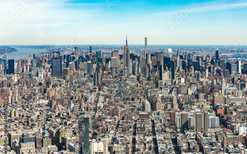 Aerial view of New York City Manhattan with skyscrapers and streets.