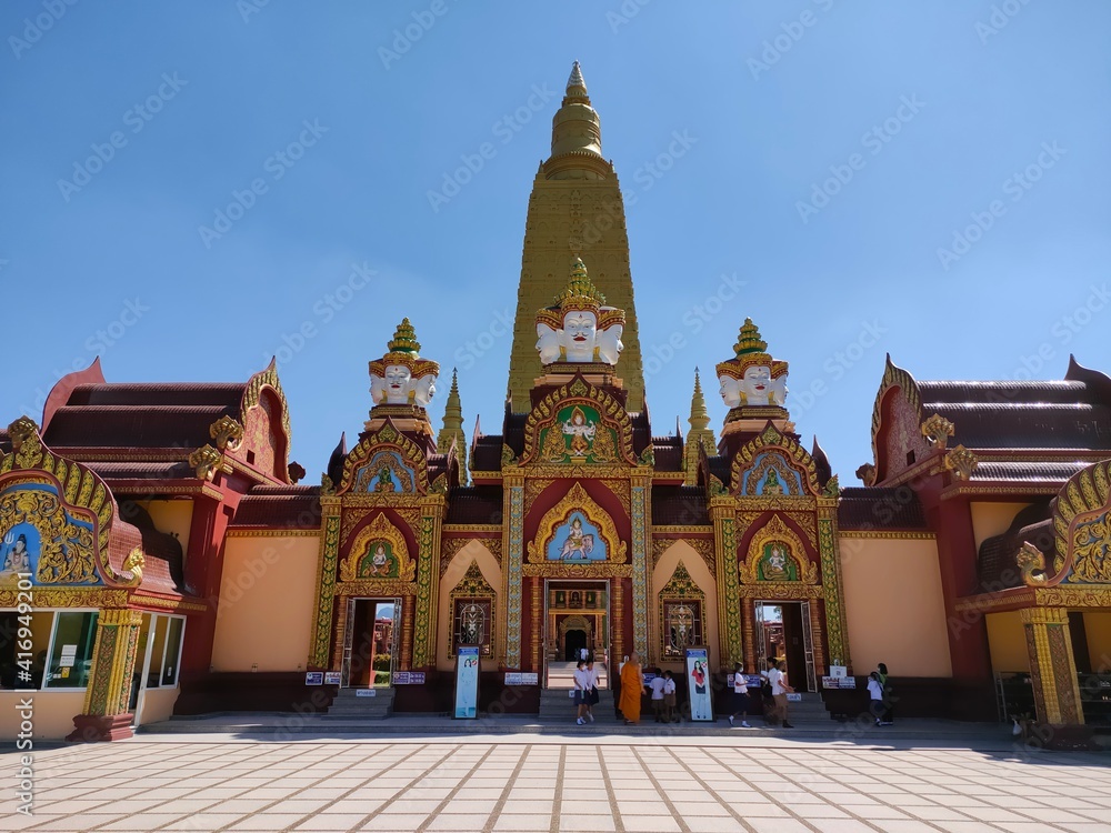entrance of temple building buddha pagoda with blue sky in thailand
