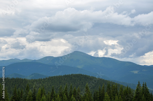 Part of Chornohora range with the highest mountain of Ukraine Hoverla in cloudy summer day. Panoramic view, Carpathian Mountains, Ukraine