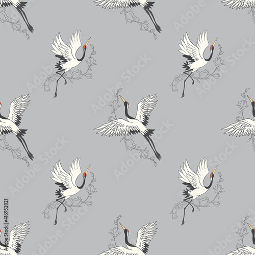 Seamless pattern with flowers and white Japanese cranes.