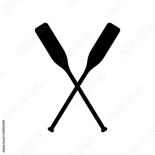 Two black silhouette of crossed oars