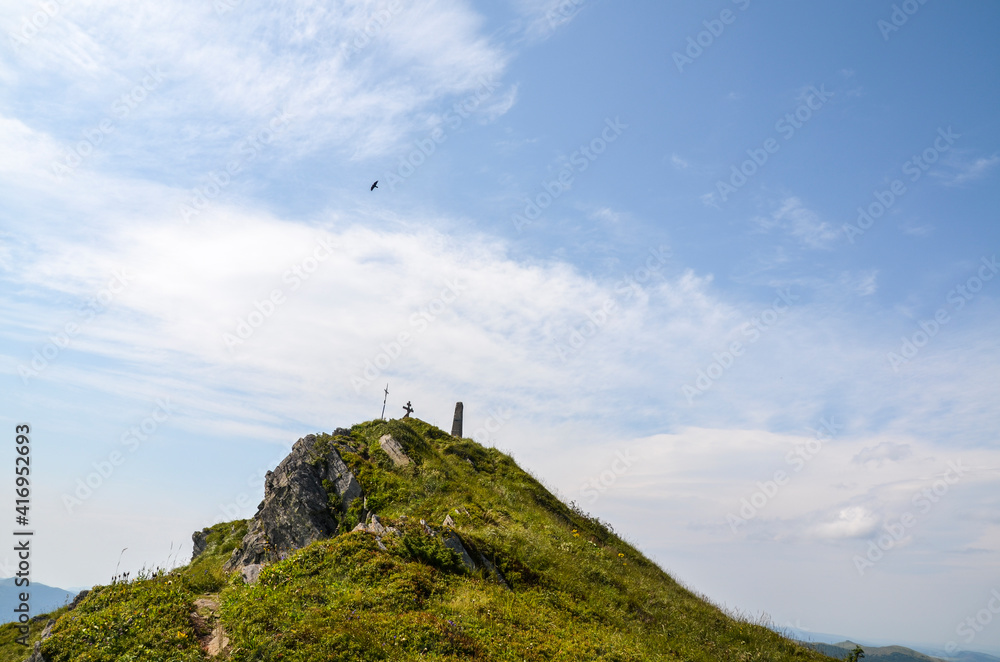 Fototapeta premium Rocky mountain peak of Pikuj against blue sky on summer day. East Beskidy, Carpathians Mountains, Ukraine