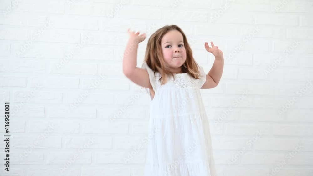 little funny girl 4 years old dancing in a white dress at home little funny girl 4 years old dancing in a white dress at home