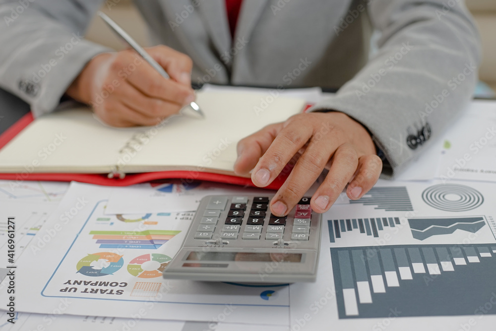 person analyzing financial figures person analyzing financial figures