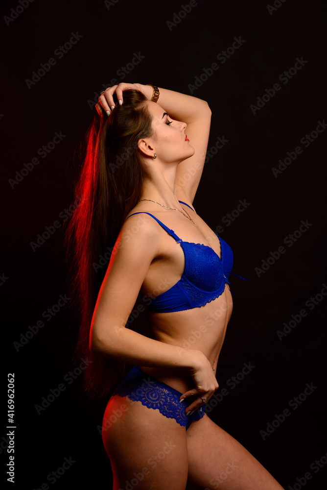 Slim tanned woman body over gray background Slim tanned woman body over gray background