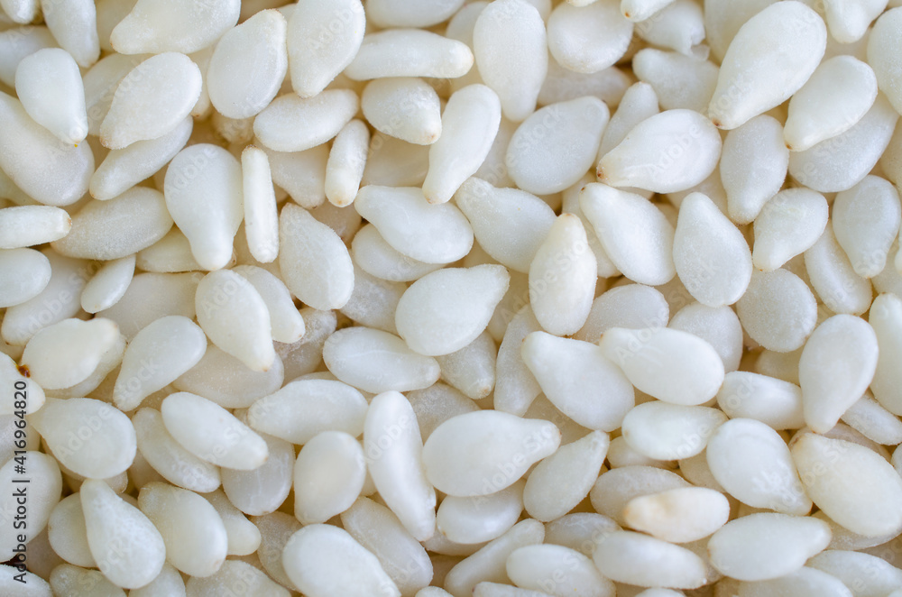 Dry organic white sesame seed background Dry organic white sesame seed background