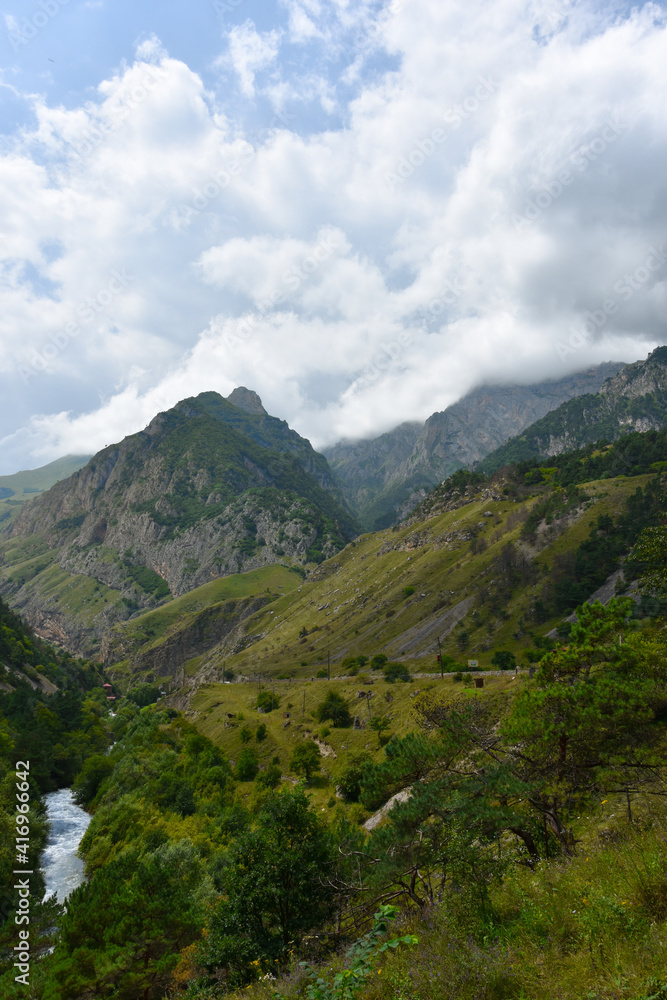 Large and small rivers and waterfalls in North Ossetia against the backdrop of majestic mountains. Republic of North Ossetia - Alania