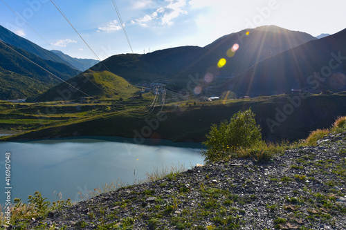 Panorama of the Zaramag reservoirs in the mountains of the North Caucasus on a hot summer day. Republic of North Ossetia - Alania photo