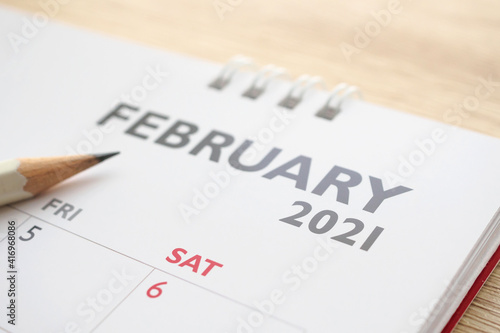February month on 2021 calendar page with pencil business planning appointment meeting concept