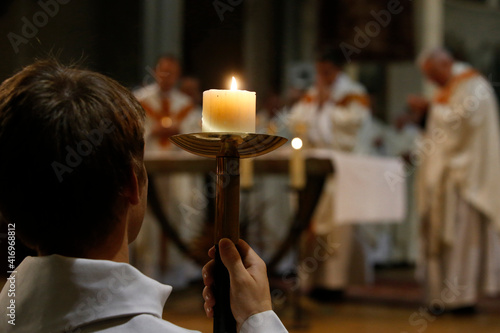 Deacon ordinations in Notre Dame du Travail, Paris. France. Altar boy. 22.03.2018 photo