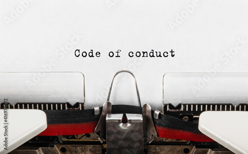 Text Code of conduct typed on retro typewriter photo