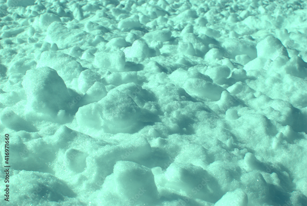 Lumpy snow on the ground with the image tinted green. Lumpy snow on the ground with the image tinted green.
