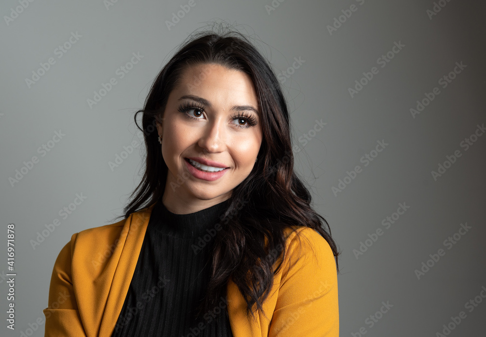 Studio headshot of beautiful young Latina business woman with room for copy. Studio headshot of beautiful young Latina business woman with room for copy.