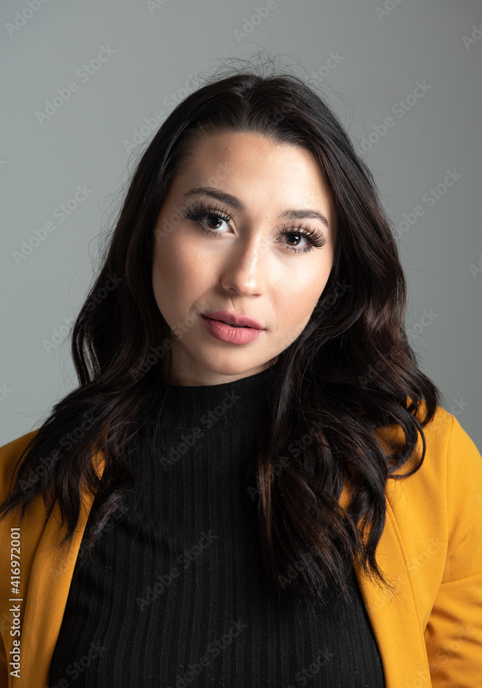Studio headshot of beautiful young Latina business woman with room for copy. Studio headshot of beautiful young Latina business woman with room for copy.