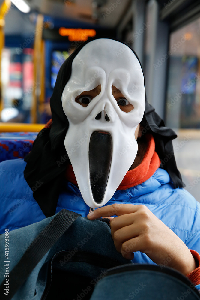 Teenager wearing a mask on the eve of Halloween, London, U.K. 28.10.2019