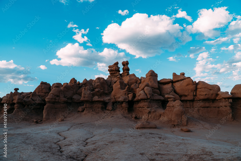 Rocks at Goblin Valley state park, Utah, on a blue sky cloudy day.