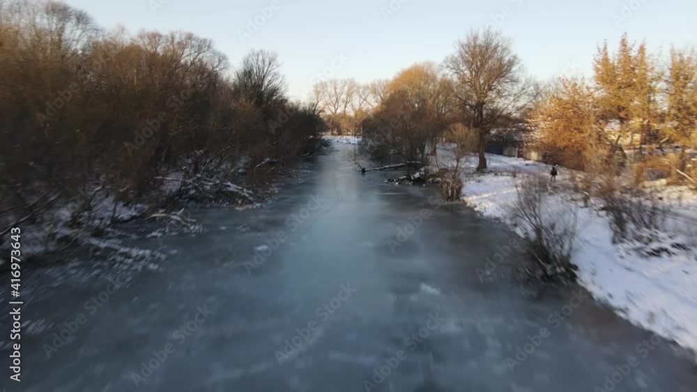 The frozen river. The coast is covered with snow. The frozen river. The coast is covered with snow.