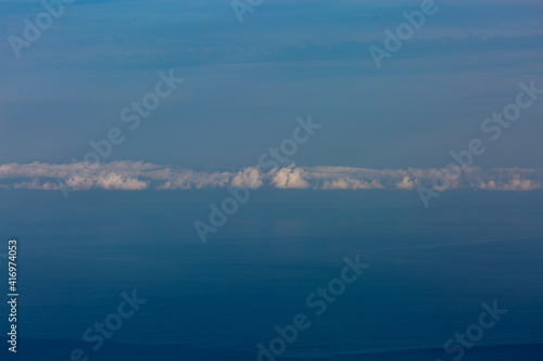 Blue sky with clouds over sea. Nature composition.