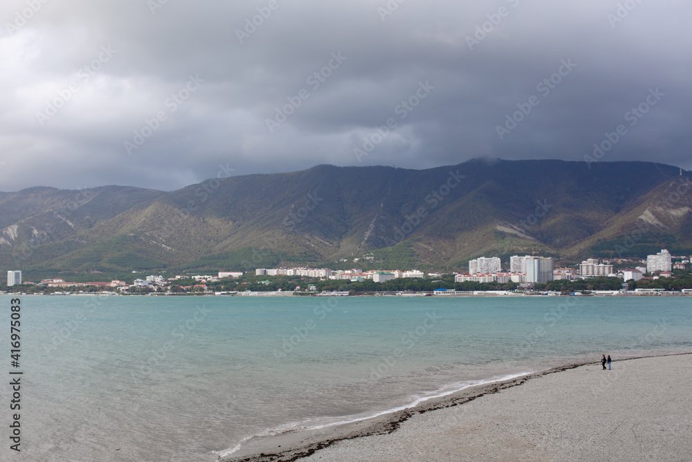A deserted beach with views of the city A deserted beach with views of the city