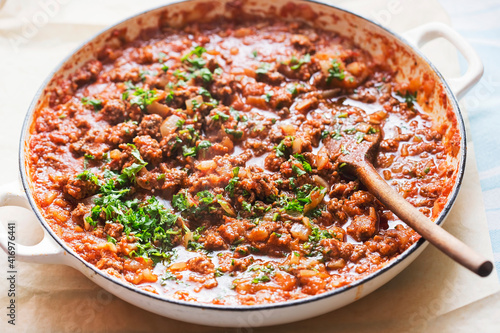 Bolognese beef sauce with tomatoes and parsley 