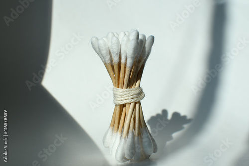 Wooden Ear Sticks
on a white background. Ecological product is absolutely safe for healthy teeth and clean environment.
Zero waste concept. Eco-friendly materials.