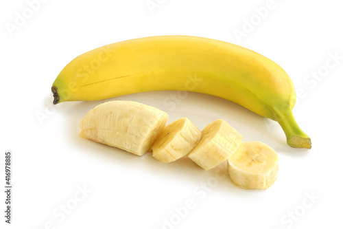 Whole banana and slices isolated on white