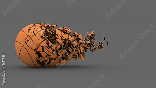 Foto half destroyed basketball ball with fragments flying off
