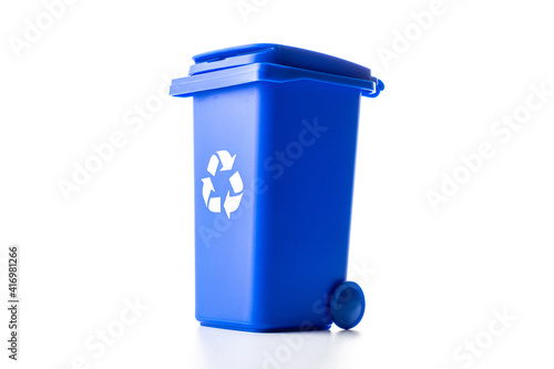 Trash bin. Blue dustbin for recycle paper trash isolated on white background. Container for disposal garbage waste and save environment. photo