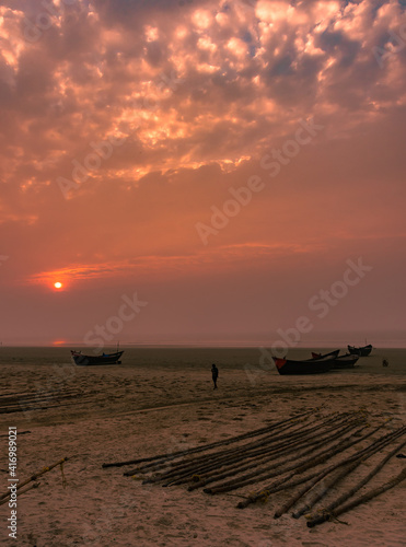 Silhouette of a Wooden Boat with Dramatic Sky. photo