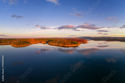 Принти на полотні Drone aerial view of a lake reservoir of a dam with perfect reflection on the wa