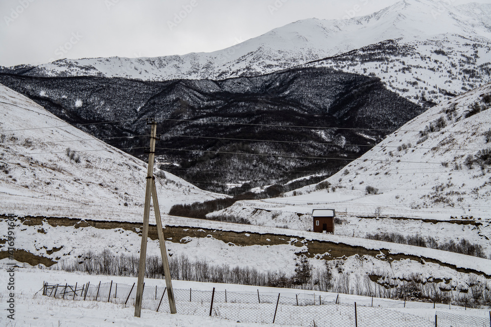 Fototapeta premium panoramic landscape of the snow-capped mountains and gorges of the Caucasus