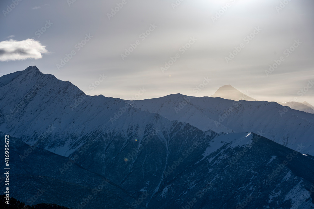 panoramic landscape of the snow-capped mountains and gorges of the Caucasus 