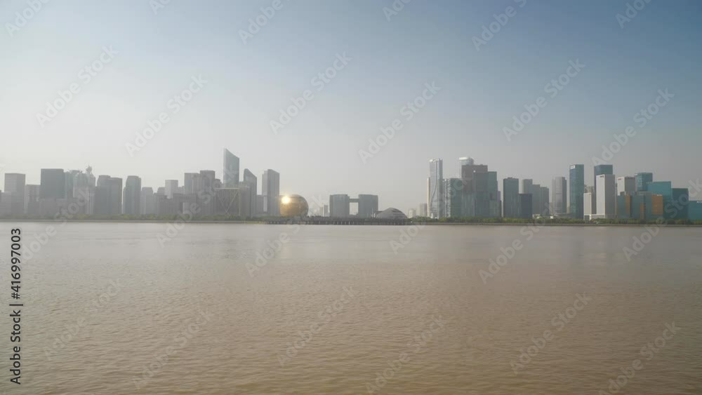 sunny day time hangzhou city famous downtown modern buildings riverside bay slow motion panorama 4k china sunny day time hangzhou city famous downtown modern buildings riverside bay slow motion panorama 4k china
