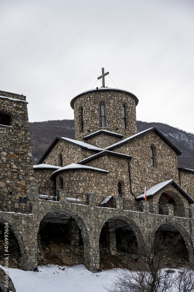 gray stone Christian church in the mountains in the Caucasus 