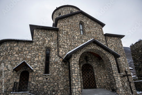 gray stone Christian church in the mountains in the Caucasus 