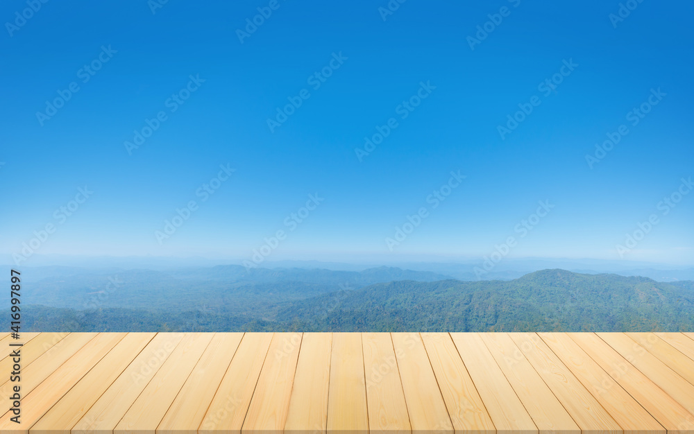 Wooden table in front of mountain natural view background